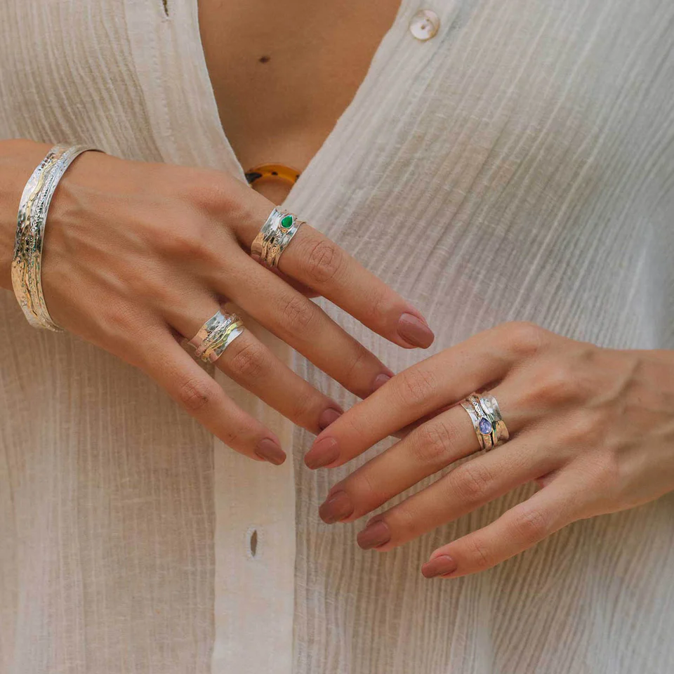 Women wears rings on both hands and bracelet 